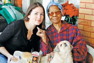 Aging True employees and volunteers deliver Meals on Wheels to clients and their pets.