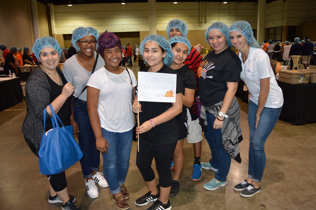 Volunteers from Advantage Dermatology help out at a Hunger Fight packing event.