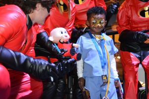 Superheroes come in many forms: a young surgeon looks over at a partner in crime, Jack-Jack from The Incredibles. (Photo credit: David Luck, Community Hospice & Palliative Care)