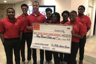 Teen servant leaders, ages 13-18, in I'm A Star Foundation presented a check for $30,000 before the Duval County Public School Board Nov. 7.