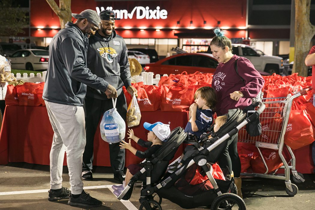 Jaguars' Malik Jackson, the USO and Winn-Dixie give 300 turkeys to military families to celebrate the Thanksgiving holiday. (Deremer Studios Jacksonville Commercial Photography)