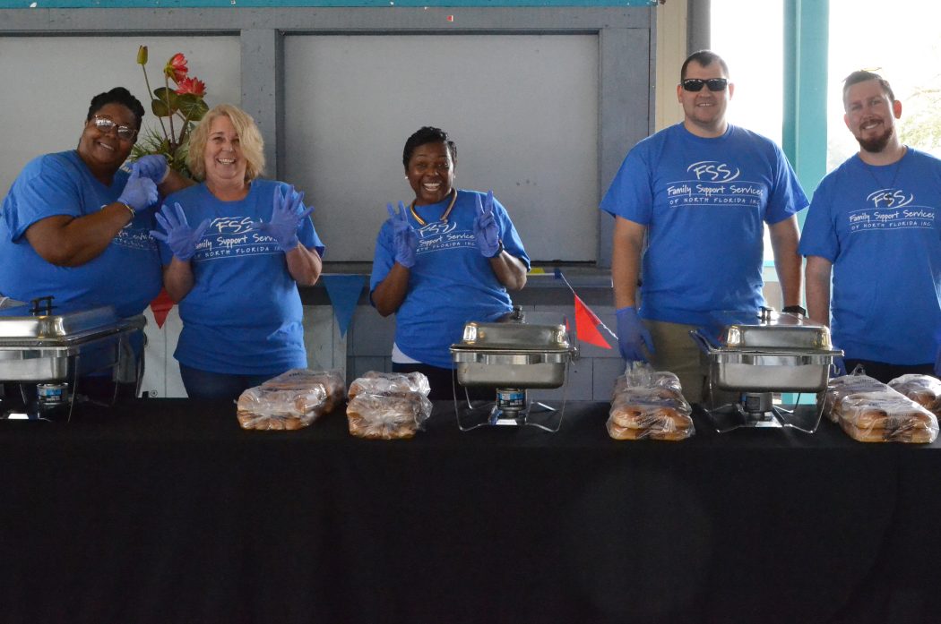 FSSNF staff and volunteers prepare to serve lunch to caregivers.