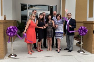 (Front): Amy Davis, Andrea Fritz, Christine Chapman, Susan Ponder-Stansel, (back) Jim Monaham, John Mcllvaine, Phil Ward and Carlos Bosque celebrate the opening of Community Hospice's Stephen R. Chapman Family Community Campus in St. Augustine.