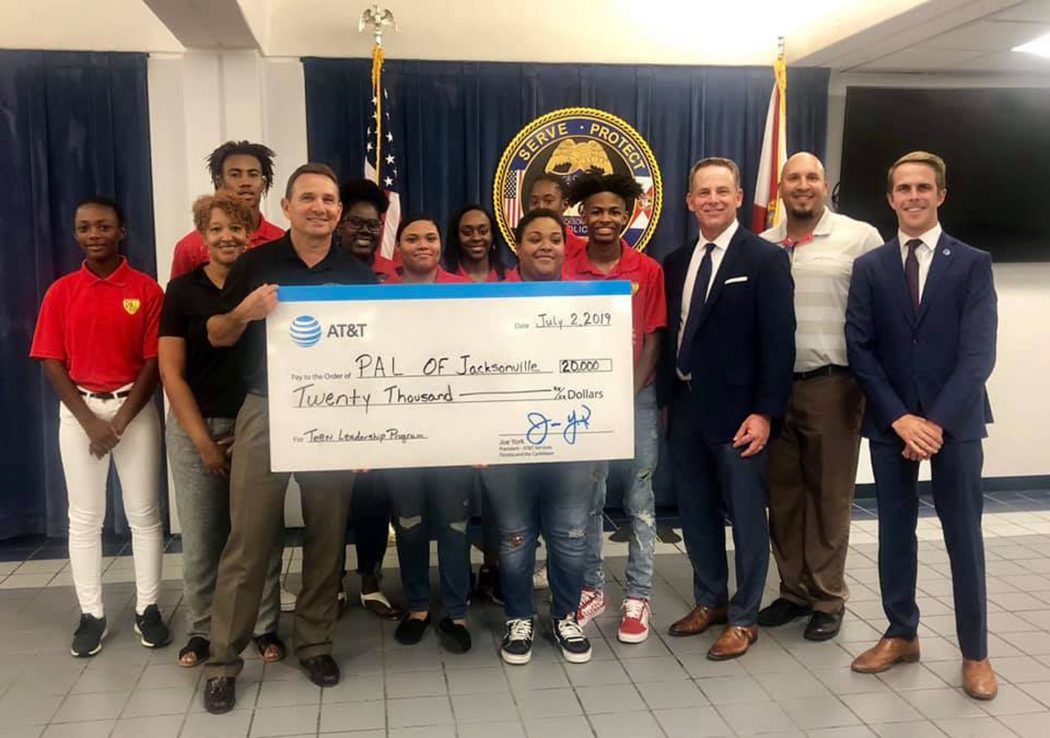 AT&T representatives present a check for $20,000 from the AT&T Foundation to Sheriff Mike Williams and JaxPAL Teen Leaders.