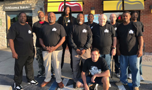 Veteran volunteers from the Clara White Mission serve at We Can Be Heroes' "Breakfast with Our Heroes." Shown are (front row) Wayne Townsend, Kevin Thompson, Herman Whing, Robert Bullington, Zachary Thompson, Chris Miller, kneeling, and (second row) John Lucky, Mone Felmar, Michael Black, Gary Corwin and Charles Smith.