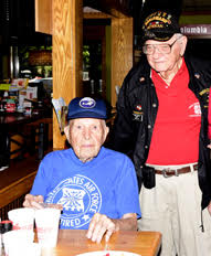 World War II veterans Walter Atwood, seated, and Bob Hall