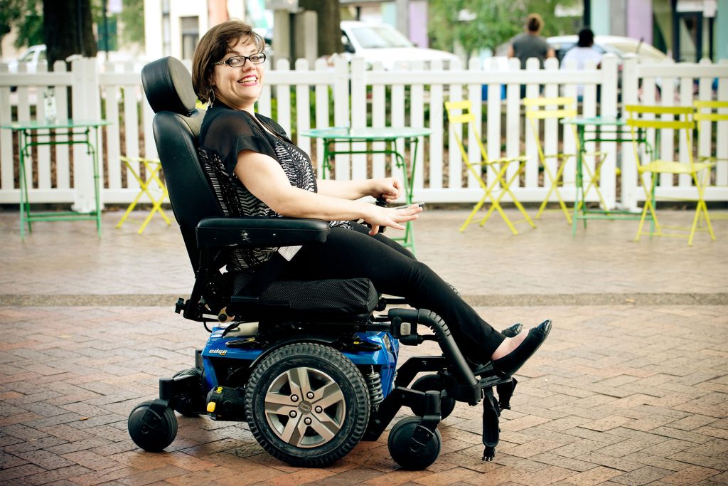 woman outside in wheelchair | Center for Independent Living
