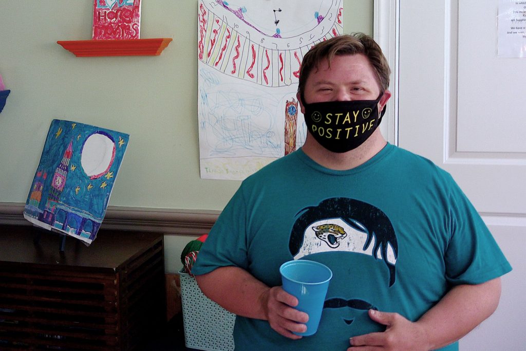 Man wearing "Stay Positive" mask | The ARC Jacksonville