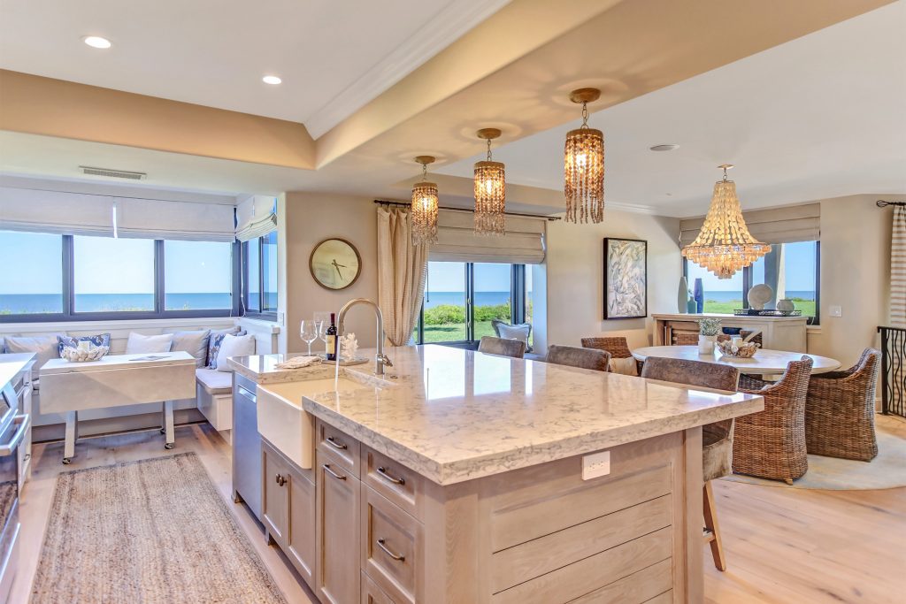 beautiful condo interior kitchen and dining area with waterfront view